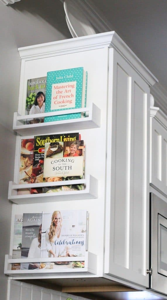Cookbook racks on the side of the kitchen cabinet to save space. (image and tutorial: the2seasons)